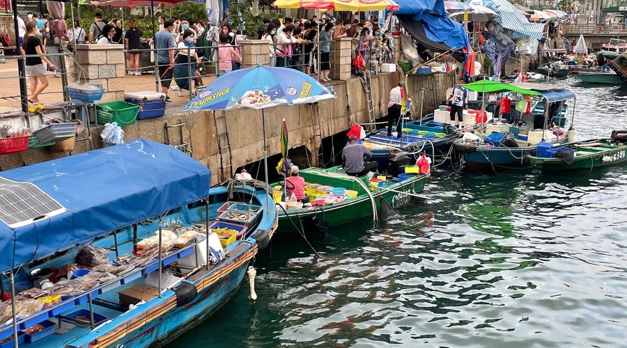 The colourful floating fish market in Sai Kung harbour.