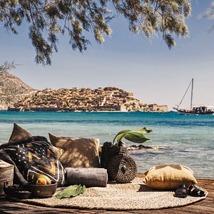Sandy beach overlooking the islet of Spinalonga in Elounda, Crete