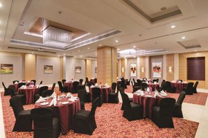 Hotel Express Inn, Nashik in Nashik, image may contain: Indoors, Fun, Hall, Banquet