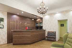 Comfort Hotel in St. Petersburg, image may contain: Chandelier, Reception, Interior Design, Table