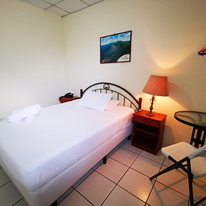 Hotel Armonia Hostal in San Salvador, image may contain: Bed, Furniture, Chair, Hotel