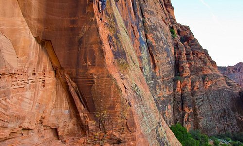 With sandstone, basalt, granite, and lava rock in canyons, alpine mountains, and sprawling deserts, Greater Zion offers the greatest variety of climbing opportunities found anywhere in the United States. –Climber scales Pioneer Names Wall in Snow Canyon State Park