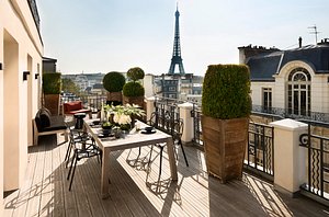 Hotel Marignan Champs-Elysées in Paris, image may contain: Balcony, Terrace, City, Dining Table