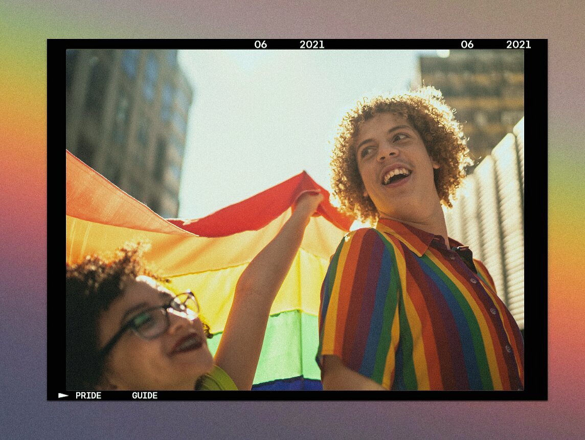 Friends dancing and having fun during pride parade