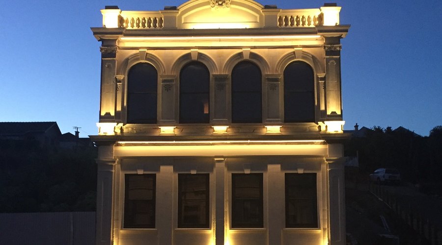 Front facade lit up at night