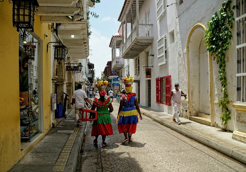 People walking in the colorful historic Walled City of Cartagena