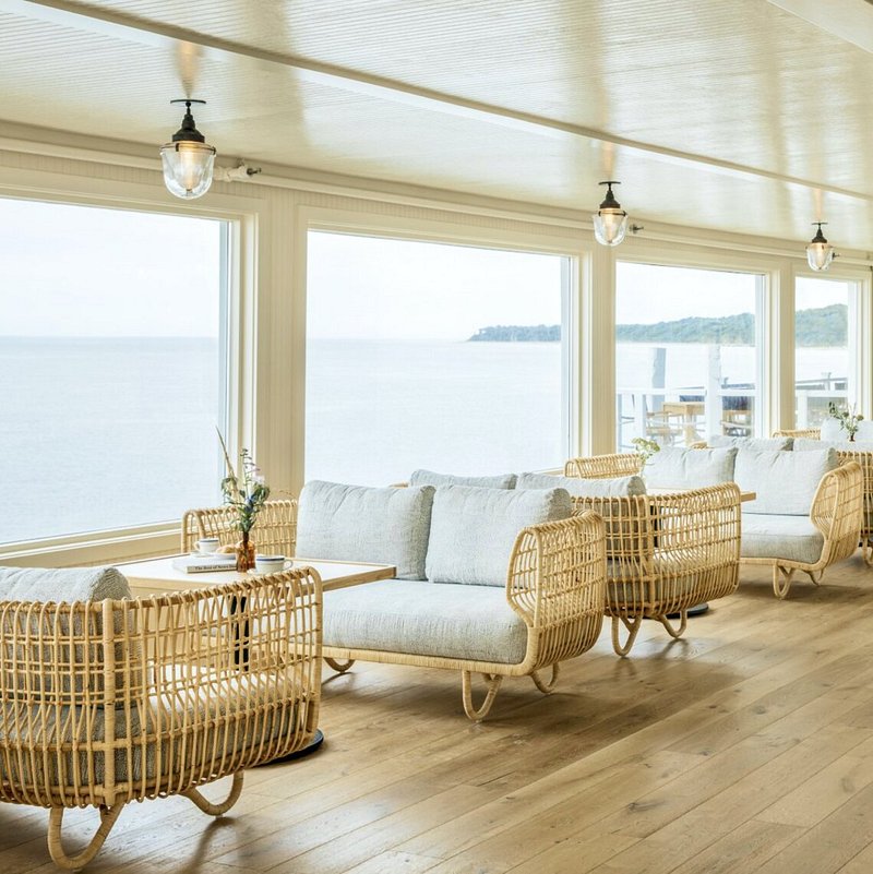 Windowed dining/living space overlooking water at Sound View