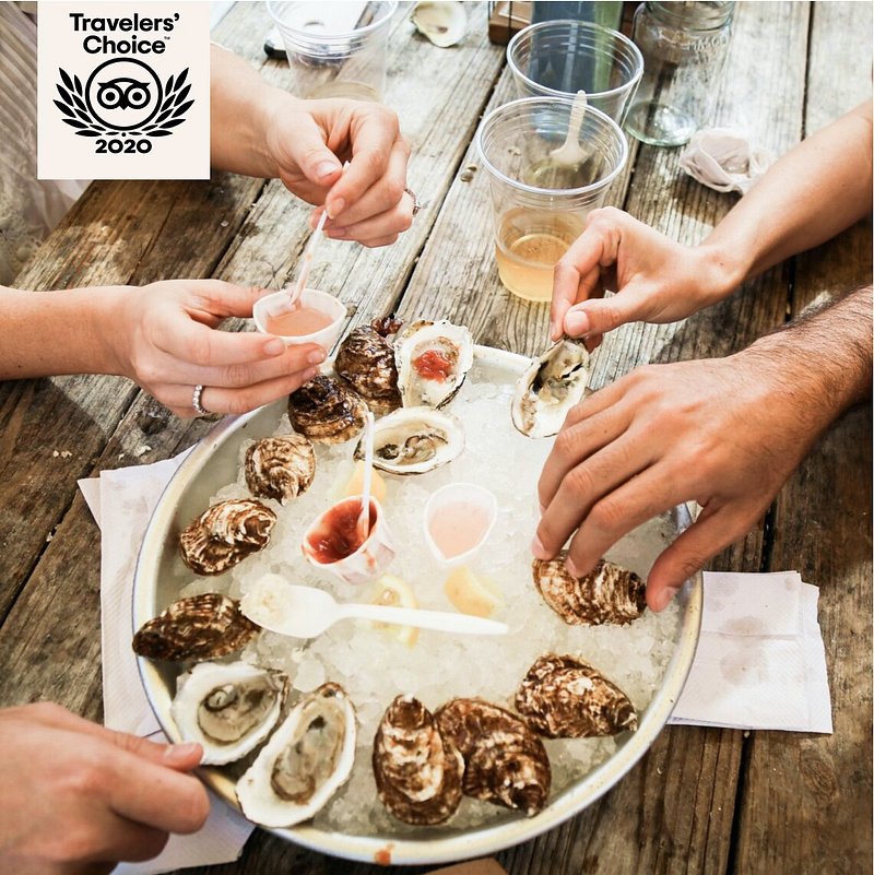 People eating oysters at Little Creek Oyster Farm & Market
