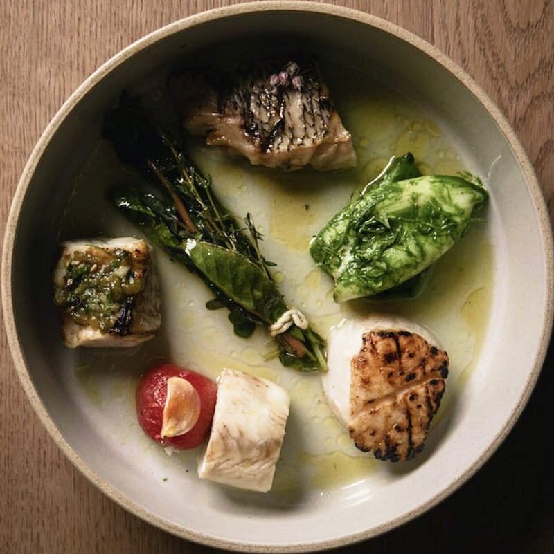 Dish with various fish and a scallop from North Fork Table & Inn