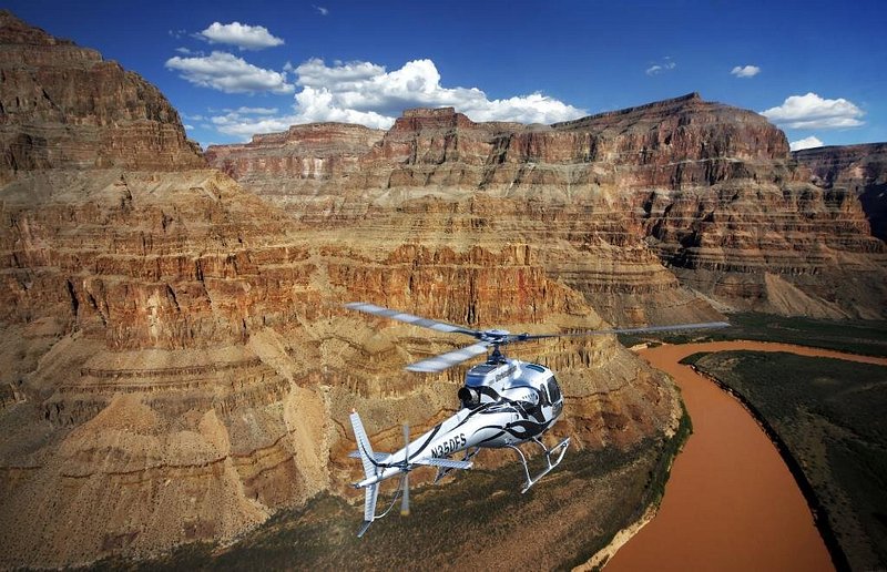 5 Star Las Vegas Helicopter Tours helicopter flying over the Grand Canyon