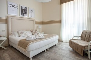 Hotel Olimpia in Forte Dei Marmi, image may contain: Furniture, Home Decor, Interior Design, Bed