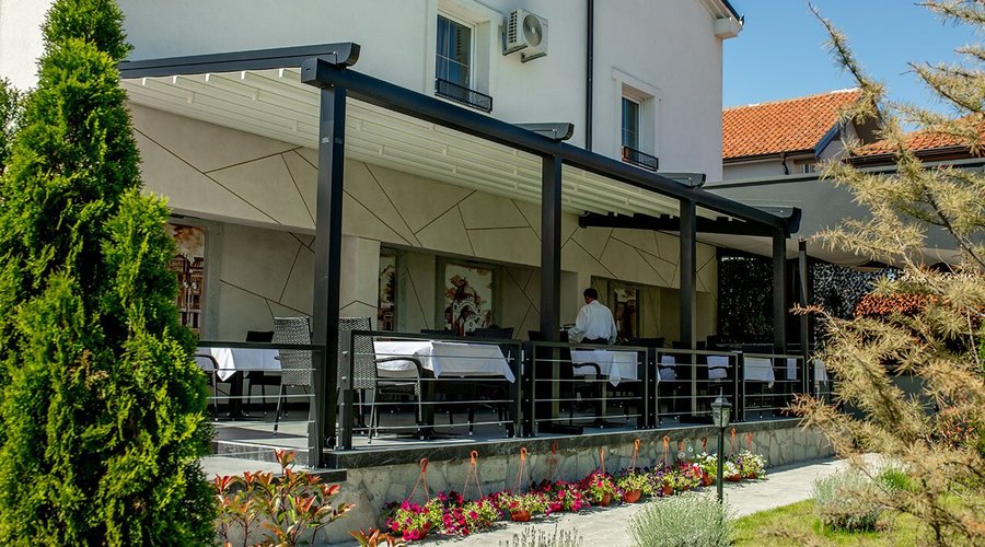 Restaurant GardeNN, Garden of the restaurant with beautiful pictures of Belgrade on the wall ...