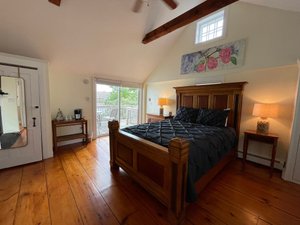 Shea's Riverside Inn & Motel in Essex, image may contain: Wood, Bed, Flooring, Lamp