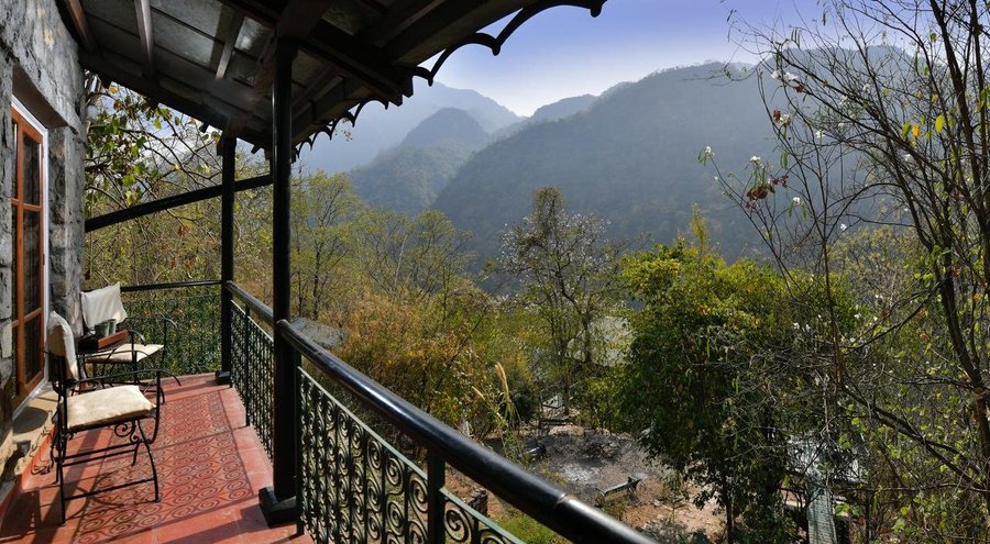 Enjoy the views of the  Garhwal Himalayas from Neemrana's Glasshouse on The Ganges.  It is a magical natural spot where you can literally open your windows in another world where clouds float in and out to show you views of the Garhwal Himalayas. 

