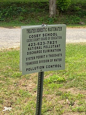 the sign right next to the creek 