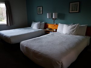 Fireweed Motel in Smithers, image may contain: Table Lamp, Lamp, Bed, Painting