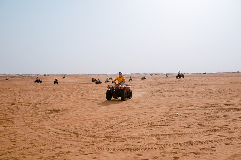 A man ride on a quad bike in the Dubai desert