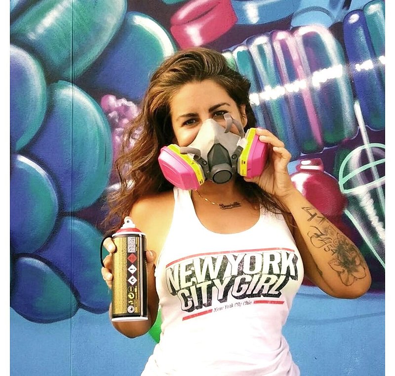Danielle Mastrion holding can of spray paint