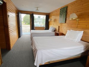 Hillcrest Motel in Saint John, image may contain: Interior Design, Indoors, Wood, Bed