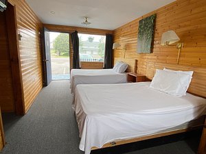 Hillcrest Motel in Saint John, image may contain: Interior Design, Indoors, Wood, Bed