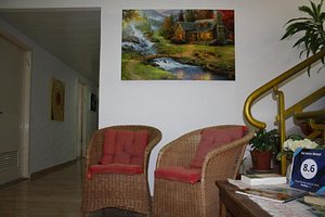 Ga'aton Motel in Nahariya, image may contain: Living Room, Couch, Chair, Potted Plant