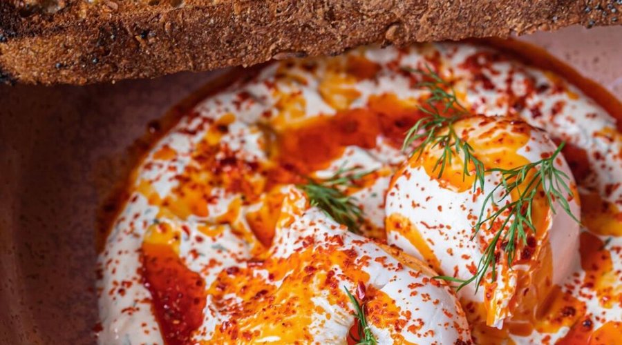 Poached eggs on herbed yoghurt with Aleppo butter