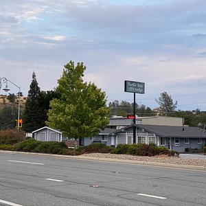On a busy road, adjacent to a number of other motels