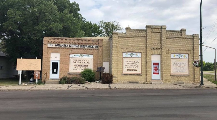 The front of Sipiweske Museum. 
The left side of the building is the 1901 Wawanesa Mutual Insurance Company building and the right side is the addition the company made in 1907.