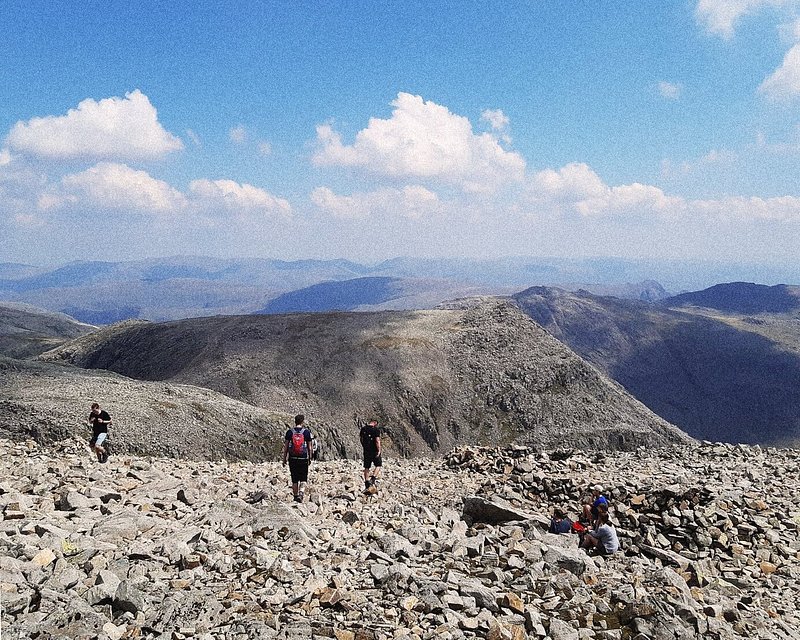 A group of hikers walking on Scafell Pike