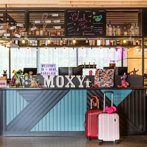 There’s a drink waiting for you with your room key, enjoy our lively living room, welcom to Moxy !