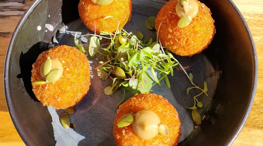 pumpkin and sage arancini balls with black garlic aioli
