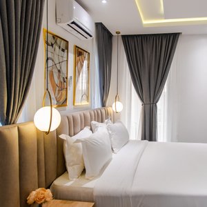 George Residence in Lagos, image may contain: Home Decor, Cushion, Lighting