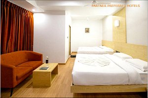 PPH Living Railotel Coimbatore in Coimbatore, image may contain: Book, Furniture, Bed, Couch