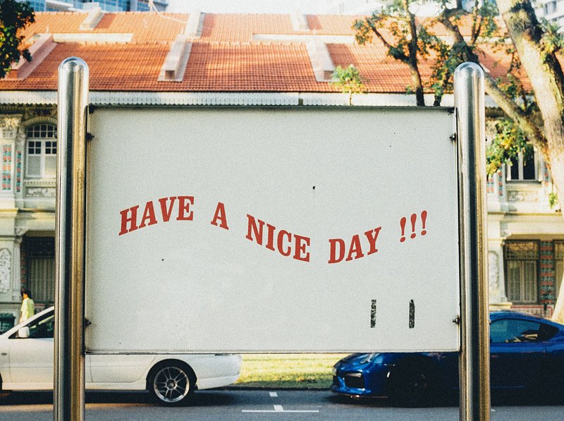 A white sign that says have a nice day on it