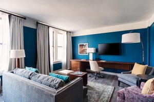 The Commonwealth in Richmond, image may contain: Home Decor, Couch, Living Room, Chair