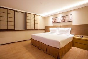Jinjiang Inn Makati in Luzon, image may contain: Corner, Furniture, Interior Design, Bedroom