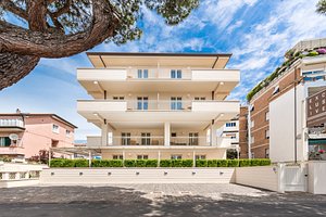 Exclusive - Hotel & Apartments in Marina di Carrara, image may contain: City, Condo, Urban, High Rise