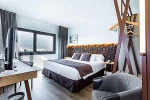 Best Western Plus Hotel Alfa Aeropuerto in Barcelona, image may contain: Interior Design, Indoors, Furniture, Bedroom