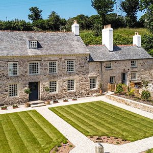 Early 18th century facade of Cusgarne Manor with south-east facing garden.