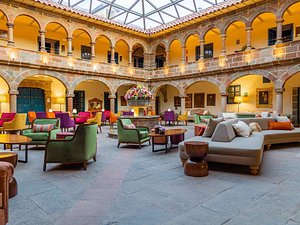 Hotel Novotel Cusco in Cusco, image may contain: Indoors, Furniture, Foyer, Building