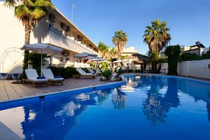 Ipsos Di Mare Hotel in Corfu, image may contain: Villa, Hotel, Pool, Chair