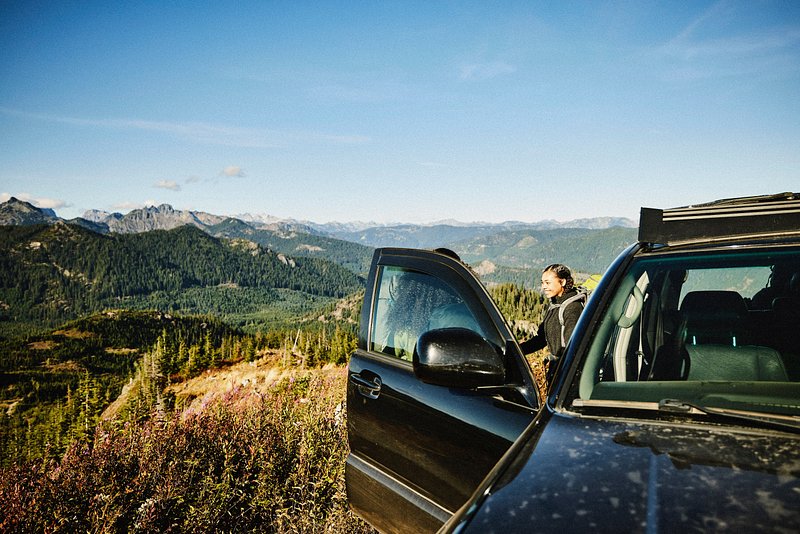 Family getting out of car to hike