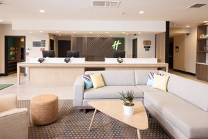 Holiday Inn Santa ANA-Orange Co. Arpt, an IHG Hotel in Santa Ana, image may contain: Table, Living Room, Home Decor, Couch