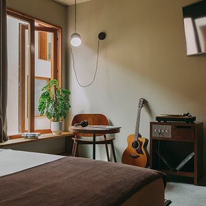 M.Ou.Co. Hotel in Porto, image may contain: Dorm Room, Bedroom, Guitar, Interior Design