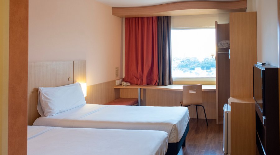 Apartamento com duas camas de solteiro