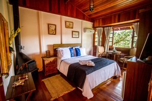 Apoema Pousada Spa in Petropolis, image may contain: Bedroom, Furniture, Indoors, Wood