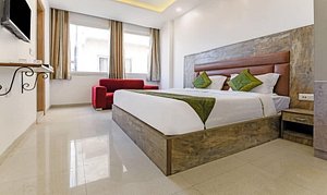 Gracious By Vishesh Hotels & Home Stay in New Delhi, image may contain: Interior Design, Floor, Home Decor, Bed