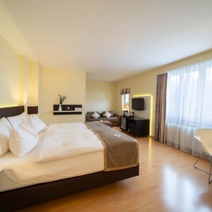 Hotel Spalentor Basel in Basel, image may contain: Chair, Furniture, Bedroom, Indoors