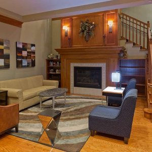 Country Inn & Suites by Radisson, BWI Airport (Baltimore), MD in Linthicum Heights, image may contain: Living Room, Staircase, Home Decor, Couch