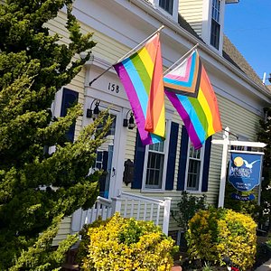 Our Historic front door with Pride flags (no longer an entrance).